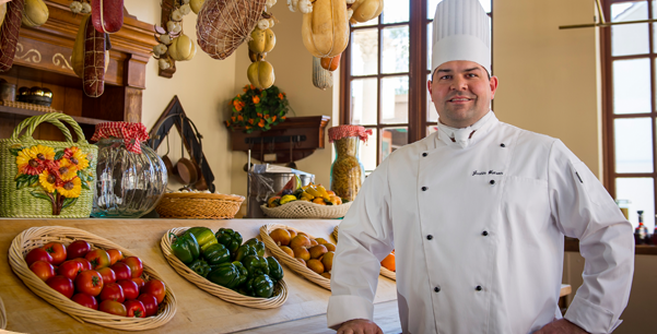 Busch Gardens Tampa Food Wine Festival Chef with produce 