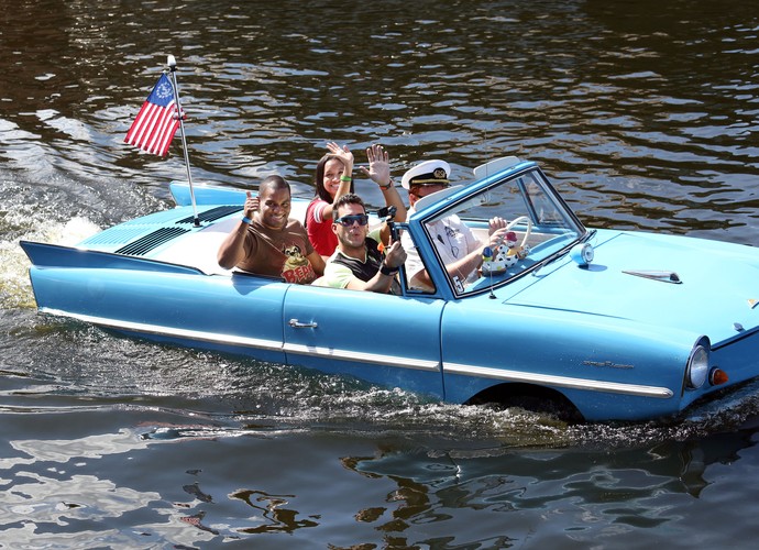 Disney Springs Amphicar passengers waving hello 